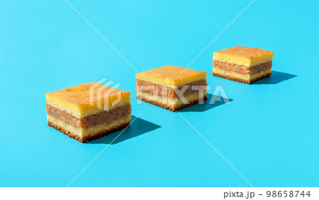 Apple pie slices isolated on a blue background 98658744
