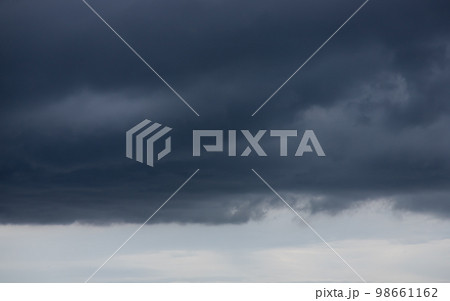 Clouds background, Rain clouds become dark gray like a big smoke before rainfall. 98661162