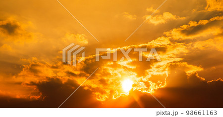 Gorgeous panorama scenic of the strong sunset, sunrise with silver lining and cloud on the orange sky Gorgeous panorama scenic of the strong sunset, sunrise with silver lining and cloud on the orange sky 98661163