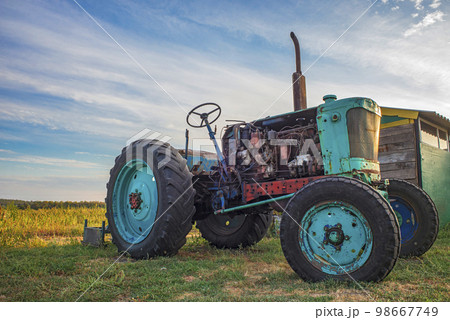 old tractor in field 98667749