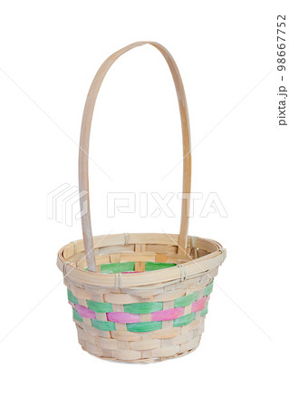An empty wicker basket isolated on white background. Easter item An empty wicker basket isolated on white background. Easter item 98667752
