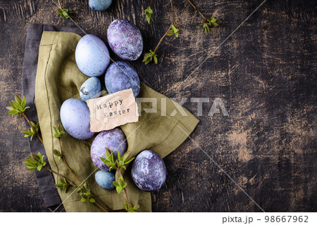 Festive Easter eggs in purple and blue color Festive Easter eggs in purple and blue color 98667962