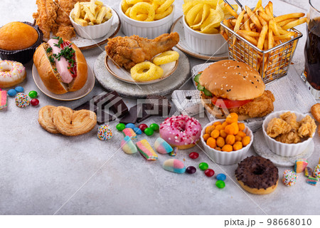 Assortment of various unhealthy junk food. Assortment of various unhealthy junk food. 98668010