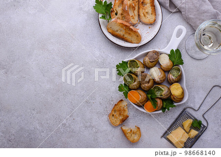 Baked snails Escargot with bread 98668140
