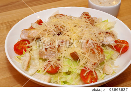 Caesar salad with chicken and crackers 98668627