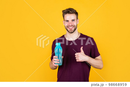 thumb up. man relax after sport. feeling thirsty. keep water balance in body. hydration. 98668959