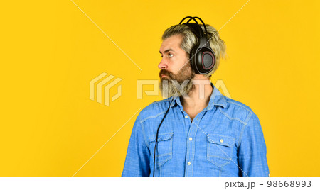 Rhythm concept. Man bearded hipster headphones listening music. Hipster enjoy excellent sound song in earphones. Excellent music playlist. Noise cancellation function. Professional gadget. Music beat 98668993