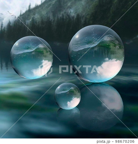 Transparent water spheres against a stunning backdrop of mountains and water. Reflection of the landscape and elements inside the spheres 98670206