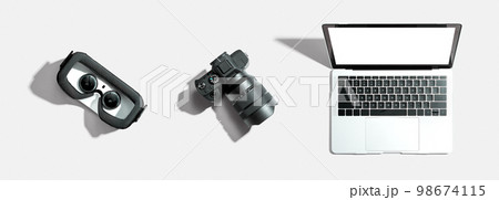 Tech gear theme with vr headset, dslr camera and laptop 98674115