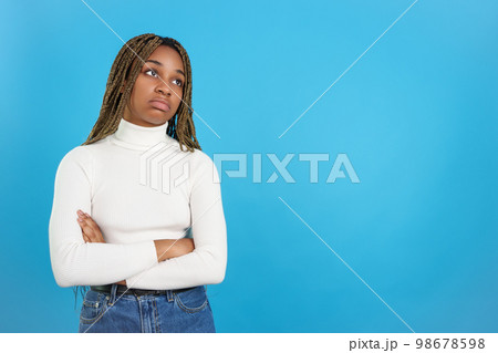 African bored woman standing with her arms folded 98678598