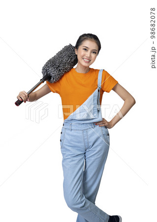 Asian young housewife holding feather duster 98682078