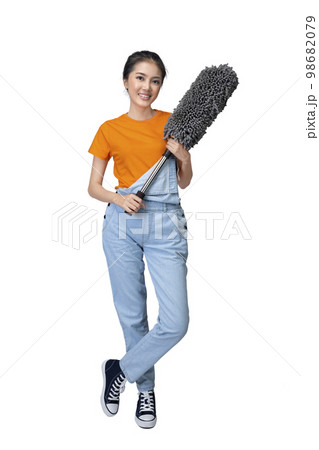 Asian young housewife holding feather duster 98682079