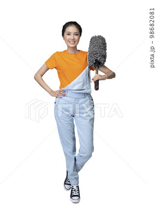 Asian young housewife holding feather duster 98682081