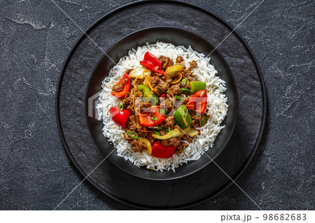 crispy ground beef with stir-fried veggies in bowl crispy ground beef with stir-fried veggies in bowl 98682683