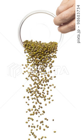 Green mung beans fly throw up in glass bowl, green mung bean float explode, abstract cloud fly. Dried green mung beans splash throwing in Air. White background Isolated high speed shutter, freeze 98683734
