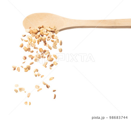 Roasted Peanut bean fall down in wooden spoon, Roasted Peanut bean float explode, abstract cloud fly. Roasted Peanut beans splash throwing in Air. White background Isolated high speed shutter, freeze 98683744
