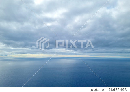 Beautiful picturesque view of the cloudy landscape and the sea, the ocean. Natural landscape overlooking the ocean. 98685498