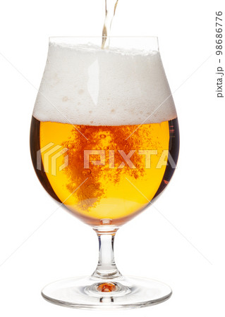 Pouring beer in tulip glass isolated on white Pouring beer in tulip glass isolated on white 98686776