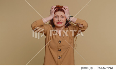 Young pretty woman loses becoming surprised by lottery results, bad fortune, loss, unlucky news 98687498