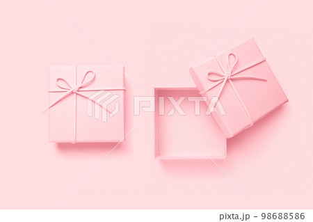 Top view of empty open gift box for congratulations on pink background. 98688586