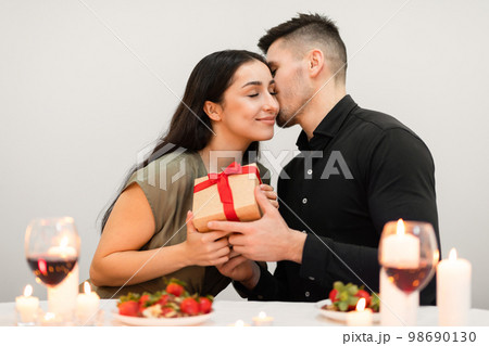 Affectionate couple have valentine day celebration at home, copy space Affectionate couple have valentine day celebration at home, copy space 98690130