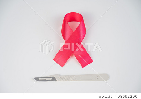Pink altals ribbon and scalpel. Symbol of the fight against breast cancer. Pink altals ribbon and scalpel. Symbol of the fight against breast cancer. 98692290