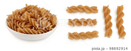 Wolegrain fusilli pasta from durum wheat in bowl isolated on white background with full depth of field. 98692914