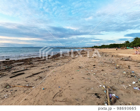 Garbage washed up on the beach from the ocean after high tide. An environmental disaster 98693665