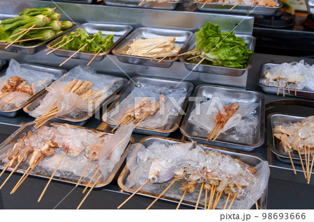 BBQ seafood preparations on the cafe counter in plates with ice 98693666