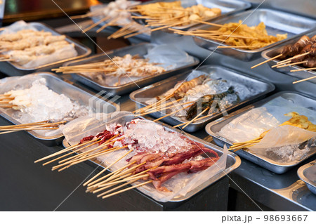 BBQ seafood preparations on the cafe counter in plates with ice 98693667
