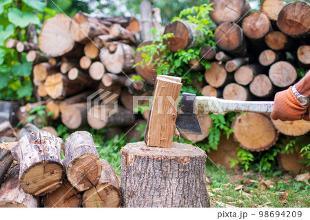 Photography on theme big steel axe with wooden handle Photography on theme big steel axe with wooden handle 98694209