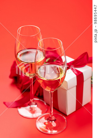 Valentines day card with champagne, rose flowers and gift box Valentines day card with champagne, rose flowers and gift box 98695447