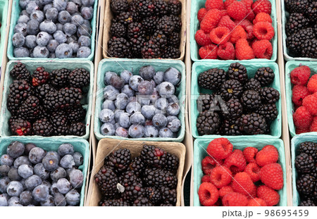 Various berries in boxes 98695459