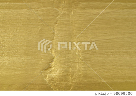 Shiny yellow leaf gold foil texture background Shiny yellow leaf gold foil texture background 98699300