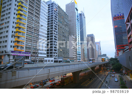 2013 May 17 Connaught road, traffic and high rise skyscraper office buildings 2013 May 17 Connaught road, traffic and high rise skyscraper office buildings 98703619