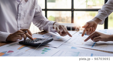 Economic business discussions, Business team analyzing income charts and graphs to plan marketing concept with using computer laptop and calculator for analysis 98703691