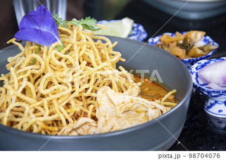 Khao Soi , Northern Thai Style Curried Noodle Soup with pork slide 98704076