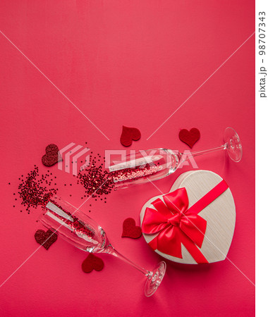 Two champagne glasses with confetti Two champagne glasses with confetti 98707343