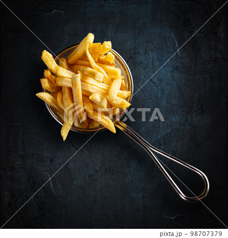 French fries in fancy metal basket 98707379