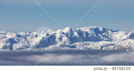 Snow and Cloud covered Canadian Nature Landscape Background. Whistler Snow and Cloud covered Canadian Nature Landscape Background. Whistler 98708236