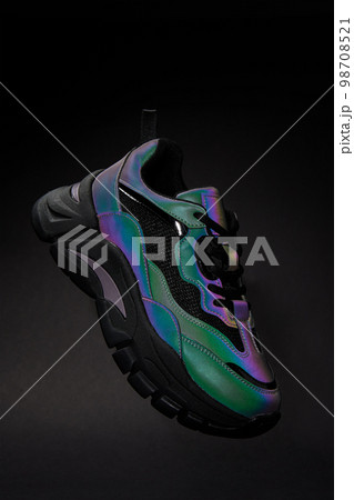 Stylish sneaker with neon gradient on black background. Glowing creative fashion shoe Stylish sneaker with neon gradient on black background. Glowing creative fashion shoe 98708521