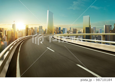 3d rendering Highway overpass motion blur with modern city 98710184