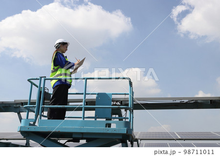 engineer working at solar farm engineer working at solar farm 98711011