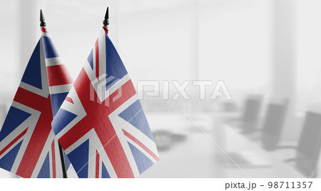 Small flags of the United Kingdom on an abstract blurry background 98711357