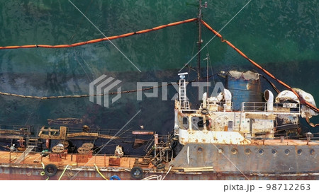 Fragment of the deck of a sunken ship. The collapse of an oil tanker. Pollution of the sea. Fragment of the deck of a sunken ship. The collapse of an oil tanker. Pollution of the sea. 98712263