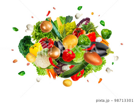 Collection of tasty fresh vegetables mix explosion on an isolated white background. Collection of tasty fresh vegetables mix explosion on an isolated white background. 98713301