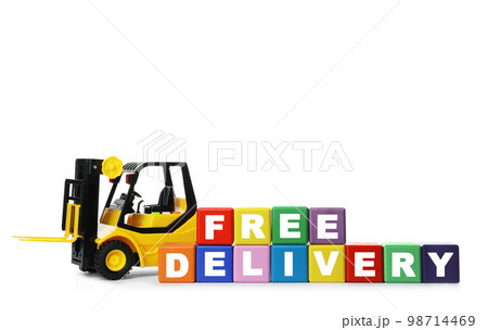 Toy forklift and cubes with words FREE DELIVERY isolated on white. Logistics and wholesale concept 98714469