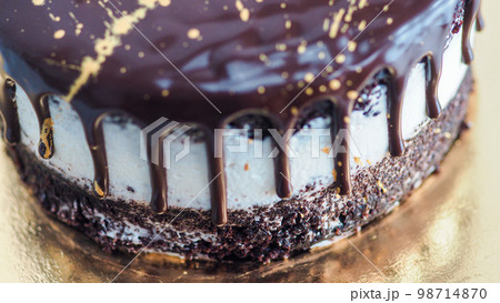 dark chocolate frosted drip cake with best wishes topping written in italian dark chocolate frosted drip cake with best wishes topping written in italian 98714870