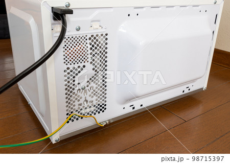Ground wire or earth wire behind a Japanese model microwave oven. 98715397