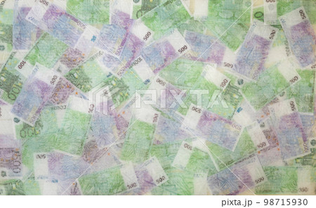 Blurred photo of one hundred and five hundred euros are defrosted in ice. The European cash currency is frozen. Blurred photo of one hundred and five hundred euros are defrosted in ice. The European cash currency is frozen. 98715930
